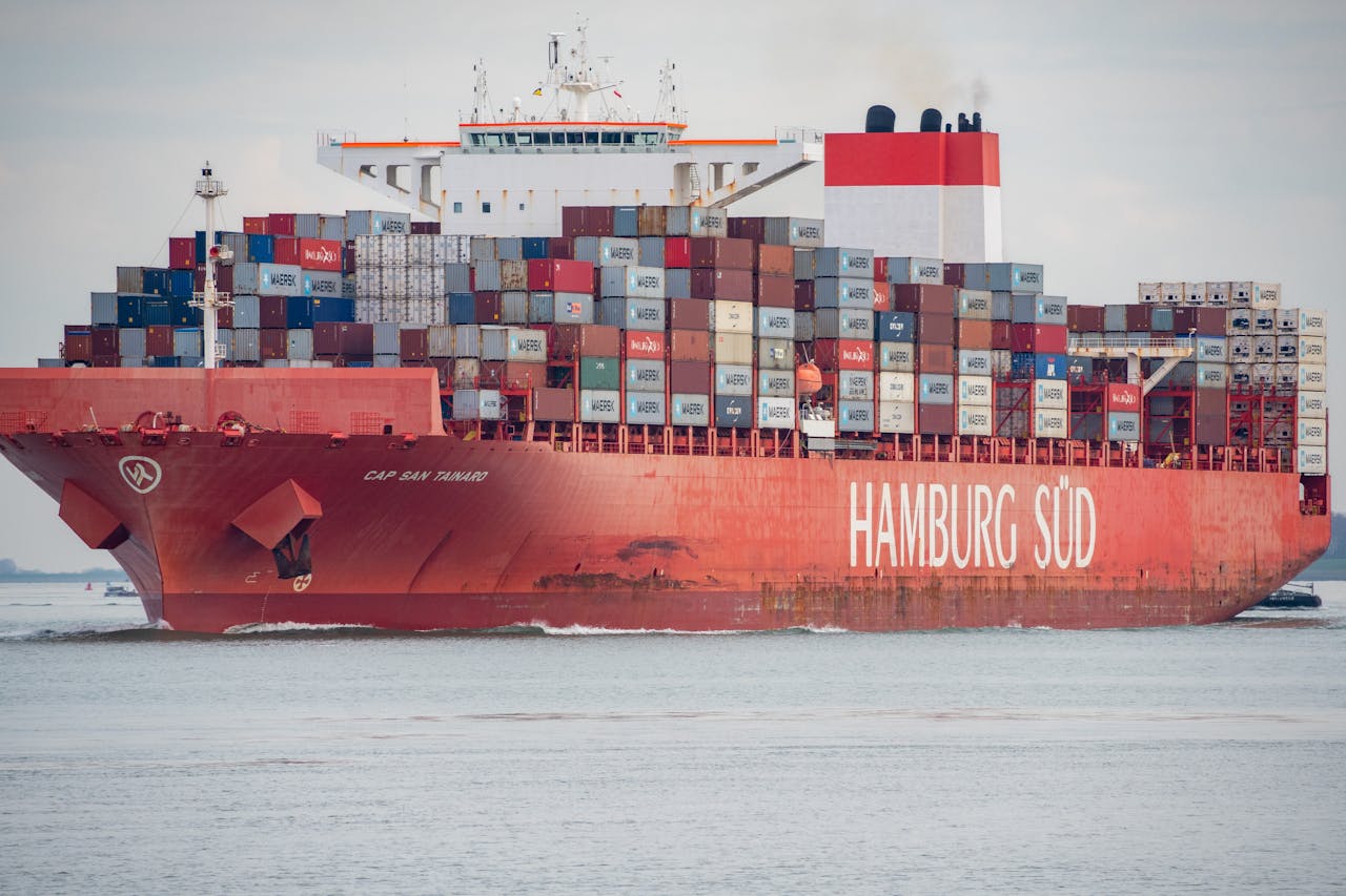 Cargo ship Hamburg Süd loaded with containers navigating waters at Terneuzen in the Netherlands.