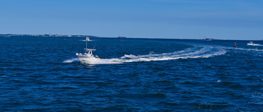 white-boat-on-sea-during-daytime-y2ee-tbquu0